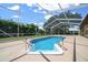 Enjoy a beautiful pool inside a screened enclosure offering the ultimate in relaxation and entertainment at 5420 Sw 86Th Ln, Ocala, FL 34476