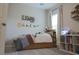 Cozy bedroom with a charming wall decor and a window at 5515 Se 91St St, Ocala, FL 34480