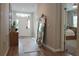 Welcoming entryway showcasing modern décor, hardwood flooring, and a clear view of the front door at 5515 Se 91St St, Ocala, FL 34480