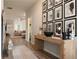 Open-concept living space featuring hardwood floors, a console table with decor and a glimpse of the living room at 5515 Se 91St St, Ocala, FL 34480