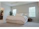 Bright main bedroom with tray ceiling, and modern decor at 5515 Se 91St St, Ocala, FL 34480