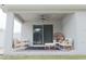 Covered patio furnished with comfortable seating, ideal for relaxing and entertaining guests at 5515 Se 91St St, Ocala, FL 34480