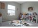 Bright playroom with a large window, playful décor, and plenty of space for children to play at 5515 Se 91St St, Ocala, FL 34480