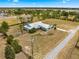 Expansive single-Gathering home with a metal roof, large yard and screened in lanai in a quiet, established neighborhood at 6045 Se 99Th Pl, Belleview, FL 34420