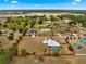 Aerial view of a home on a large lot, complete with pool and privacy at 6045 Se 99Th Pl, Belleview, FL 34420