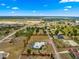 Aerial view of the home, set back on a large, expansive lot, and swimming pool at 6045 Se 99Th Pl, Belleview, FL 34420