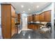 Gourmet kitchen with granite countertops, stainless steel appliances, and custom cabinetry at 6045 Se 99Th Pl, Belleview, FL 34420