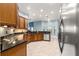 Well-equipped kitchen with stainless steel appliances, granite countertops, and lots of natural light at 6045 Se 99Th Pl, Belleview, FL 34420