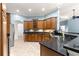 Modern kitchen featuring granite countertops, stainless steel appliances, and ample cabinet space at 6045 Se 99Th Pl, Belleview, FL 34420