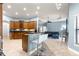 Open-concept living space showcasing the kitchen, breakfast nook, and living room, perfect for entertaining at 6045 Se 99Th Pl, Belleview, FL 34420
