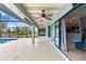Expansive covered patio overlooking the pool and backyard, perfect for outdoor entertaining and relaxation at 6045 Se 99Th Pl, Belleview, FL 34420