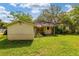 Home exterior with green backyard at 608 Se 31St Ter, Ocala, FL 34471
