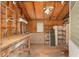 Rustic garage interior featuring wooden walls and ceiling at 608 Se 31St Ter, Ocala, FL 34471