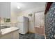 Classic kitchen with a white refrigerator and a window offering natural light at 608 Se 31St Ter, Ocala, FL 34471