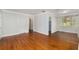 Spacious living room boasting hardwood floors and neutral paint, offering a versatile living space at 608 Se 31St Ter, Ocala, FL 34471