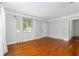Living room featuring hardwood floors, white walls, and natural light creating a bright and airy space at 608 Se 31St Ter, Ocala, FL 34471