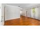 Bright living room featuring gleaming hardwood floors and neutral walls, creating a welcoming atmosphere at 608 Se 31St Ter, Ocala, FL 34471