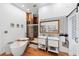 This bathroom features double sinks, a glass enclosed shower with brick accents, and a separate tub at 716 Se Wenona Ave, Ocala, FL 34471