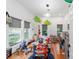 Playful bedroom with hardwood floors, big windows, and lots of natural light at 716 Se Wenona Ave, Ocala, FL 34471