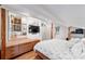 Bright, airy bedroom with ensuite bathroom featuring brick and geometric accents at 716 Se Wenona Ave, Ocala, FL 34471