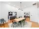 Dining area with wood floors, view to kitchen and living room at 716 Se Wenona Ave, Ocala, FL 34471