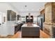 Modern kitchen features stainless steel appliances, a marble island, and gray cabinets at 716 Se Wenona Ave, Ocala, FL 34471