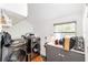 Functional laundry room with washer, dryer, and built-in storage at 716 Se Wenona Ave, Ocala, FL 34471