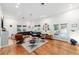 Bright living room featuring hardwood floors, white walls, and lots of natural light at 716 Se Wenona Ave, Ocala, FL 34471
