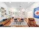 Stylish living area with hardwood floors, unique decorations, and plenty of space at 716 Se Wenona Ave, Ocala, FL 34471