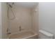 Bathroom features a tiled shower and tub combination at 8443 Sw 109Th Place, Ocala, FL 34481