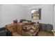 Bedroom cluttered with boxes and furniture, window to backyard at 8443 Sw 109Th Place, Ocala, FL 34481