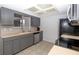 Kitchen features gray cabinets, stainless steel appliances, and tiled backsplash at 8443 Sw 109Th Place, Ocala, FL 34481