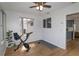 Bright sunroom features wood laminate flooring and natural light at 8443 Sw 109Th Place, Ocala, FL 34481