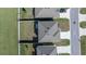 Aerial view of three homes, with focus on roof tops and neighborhood layout at 8617 Triumph Cir, Wildwood, FL 34785