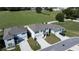 Aerial view of the neighborhood showcasing well-maintained homes and green spaces at 8617 Triumph Cir, Wildwood, FL 34785