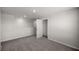 A bedroom with white walls, carpet flooring, and a built in closet at 8617 Triumph Cir, Wildwood, FL 34785