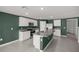 Modern kitchen with granite countertops, stainless steel appliances, and a center island at 8617 Triumph Cir, Wildwood, FL 34785