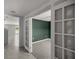 Office space featuring neutral walls, carpet flooring, and glass french doors at 8617 Triumph Cir, Wildwood, FL 34785