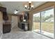 The kitchen is complete with stainless steel appliances, dark cabinets, and a sliding glass door to the backyard at 89 Fisher Way Crse, Ocklawaha, FL 32179