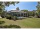 Spacious screened lanai with a refreshing pool and spa, perfect for relaxation and entertaining outdoors at 8950 Se 17Th Ct, Ocala, FL 34480