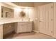 This bathroom vanity features dual sinks, plenty of counter space, and a storage cabinet at 8950 Se 17Th Ct, Ocala, FL 34480