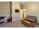 This bonus room includes carpet, a sofa, and a wall-mounted television at 8950 Se 17Th Ct, Ocala, FL 34480