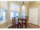 Bright breakfast nook featuring natural light and a modern pendant light at 8950 Se 17Th Ct, Ocala, FL 34480