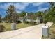 Charming single-story home with a well-maintained lawn, mature trees, and inviting curb appeal on a sunny day at 8950 Se 17Th Ct, Ocala, FL 34480