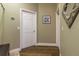 Entry way with multiple doors and wood-look flooring at 8950 Se 17Th Ct, Ocala, FL 34480