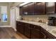 Kitchen featuring long granite countertops, cabinets, and modern appliances at 8950 Se 17Th Ct, Ocala, FL 34480
