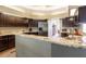 Gourmet kitchen featuring granite countertops and stainless steel refrigerator at 8950 Se 17Th Ct, Ocala, FL 34480