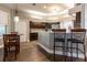Kitchen with breakfast bar, stainless steel appliances, and granite countertops at 8950 Se 17Th Ct, Ocala, FL 34480