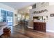 Open-concept living room with wood floors and easy access to the patio at 8950 Se 17Th Ct, Ocala, FL 34480