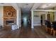 Open floor plan with hardwood floors, fireplace, dining area, and spacious layout perfect for entertaining at 8950 Se 17Th Ct, Ocala, FL 34480